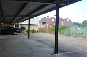 2626 Lepage St, New Orleans, LA 70119 - view of parking / parking lot featuring fence
