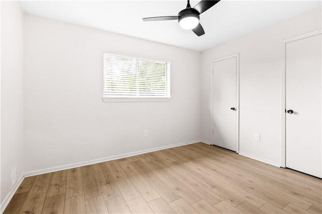 146 Bluefield Dr, Slidell, LA 70458 - unfurnished bedroom with light wood-style flooring, baseboards, and a ceiling fan