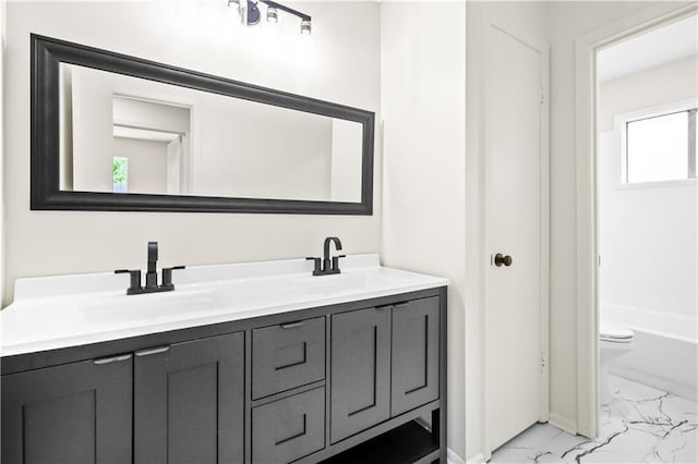146 Bluefield Dr, Slidell, LA 70458 - full bathroom with marble look tiles, double vanity, toilet, and baseboards