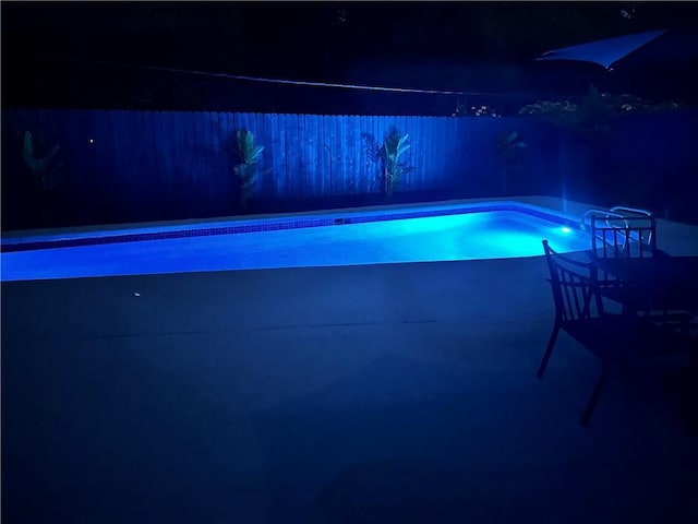 146 Bluefield Dr, Slidell, LA 70458 - pool at twilight featuring a patio area