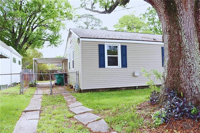 exterior space featuring a lawn, a gate, and fence