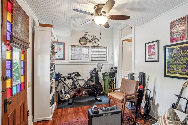 workout room with wood finished floors and ceiling fan