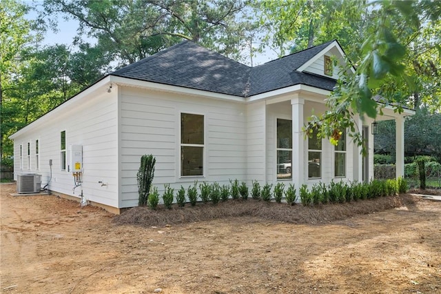 507 W 7th Ave, Covington, LA 70433 - view of home's exterior with central air condition unit and a shingled roof