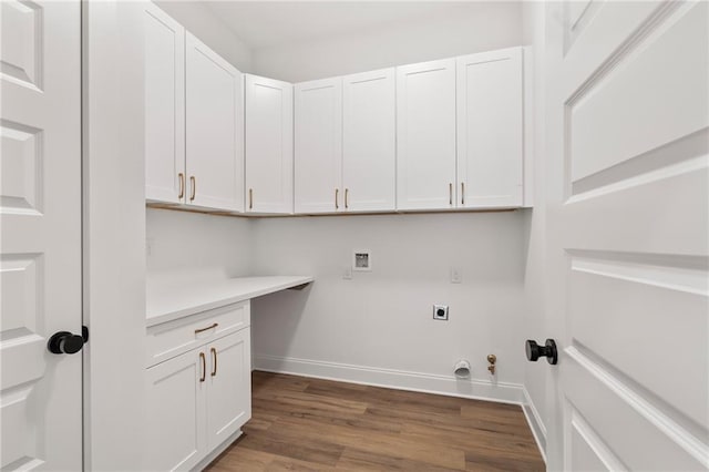 507 W 7th Ave, Covington, LA 70433 - laundry room with hookup for an electric dryer, washer hookup, baseboards, dark wood-style floors, and cabinet space