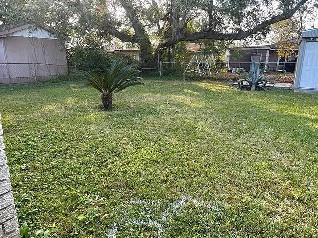 view of yard with fence