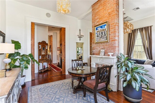 2224 N Rampart St, New Orleans, LA 70116 - dining room featuring a chandelier and dark wood finished floors