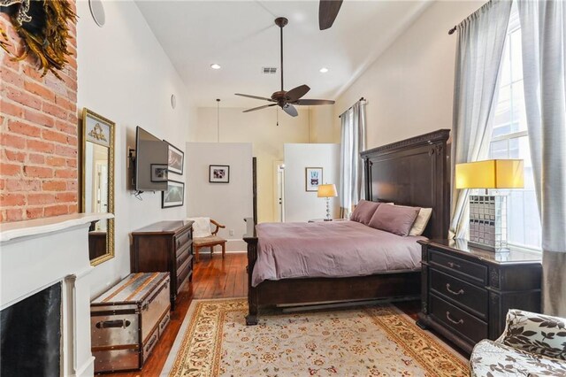 2224 N Rampart St, New Orleans, LA 70116 - bedroom featuring wood finished floors, a high ceiling, and ceiling fan