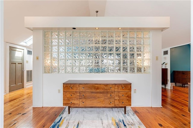 details featuring visible vents and wood finished floors