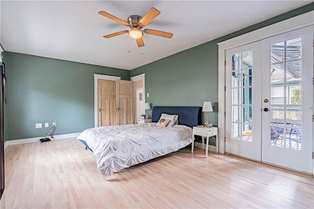 bedroom with french doors, baseboards, access to outside, and light wood-style floors