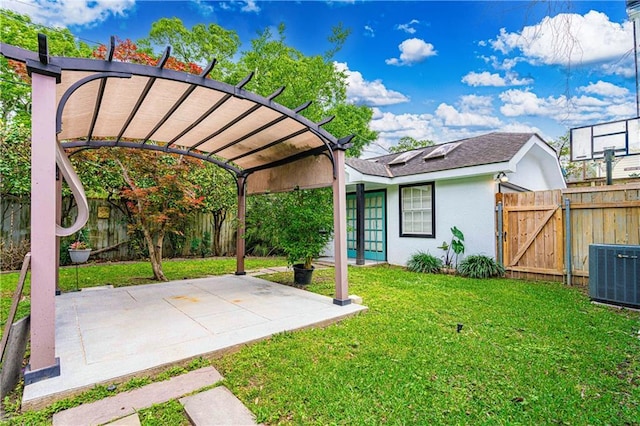 view of yard with central air condition unit, a fenced backyard, a patio area, and a gate