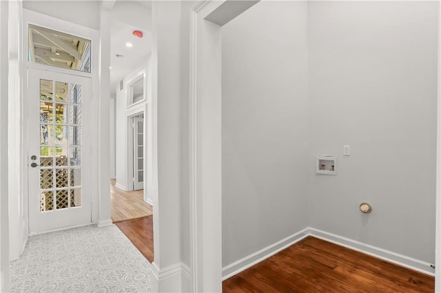 corridor with baseboards and dark wood finished floors