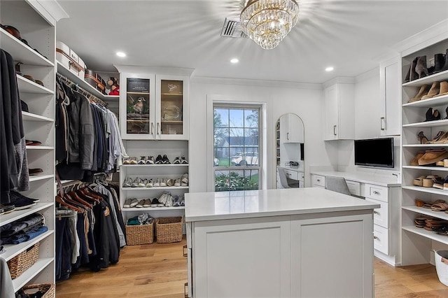 102 Liberty St, Belle Chasse, LA 70037 - spacious closet featuring visible vents, a chandelier, and light wood-style floors