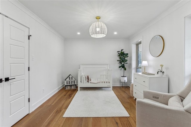 102 Liberty St, Belle Chasse, LA 70037 - bedroom featuring crown molding, baseboards, recessed lighting, and light wood-style floors