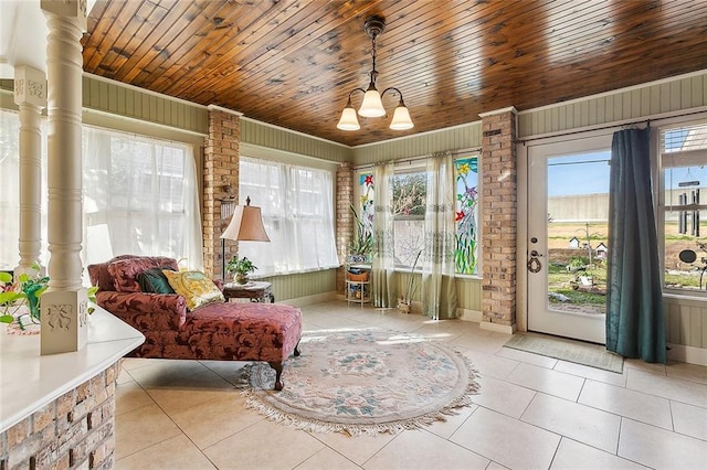 3605 W Grandlake Blvd, Kenner, LA 70065 - living area featuring tile patterned floors, a wealth of natural light, a notable chandelier, and wood ceiling