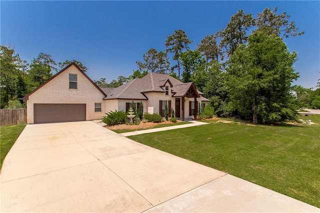 201 Belle Pointe Dr, Madisonville, LA 70447 - french country home featuring a garage and driveway