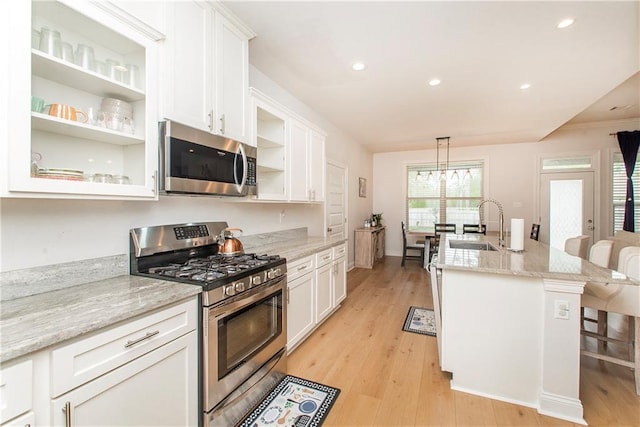 201 Belle Pointe Dr, Madisonville, LA 70447 - kitchen with appliances with stainless steel finishes, open shelves, a sink, white cabinetry, and recessed lighting
