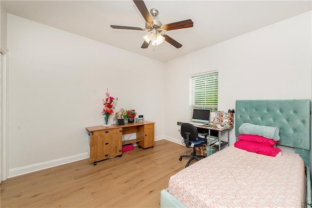 201 Belle Pointe Dr, Madisonville, LA 70447 - bedroom featuring light wood-style flooring, baseboards, and ceiling fan