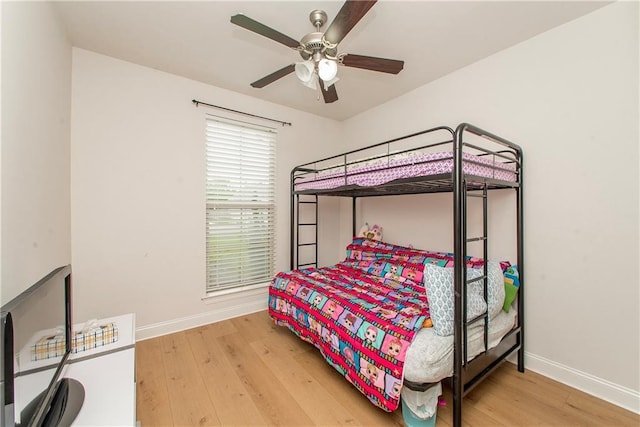 201 Belle Pointe Dr, Madisonville, LA 70447 - bedroom featuring baseboards, wood finished floors, and ceiling fan