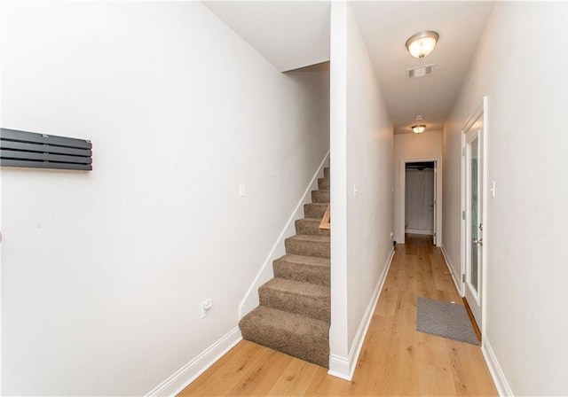201 Belle Pointe Dr, Madisonville, LA 70447 - stairway with wood finished floors and baseboards