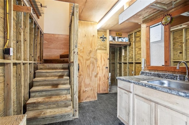 stairway featuring wood finished floors