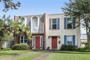 5004-0606 Newlands St, Metairie, LA 70006 - view of front of property featuring a front lawn and stucco siding