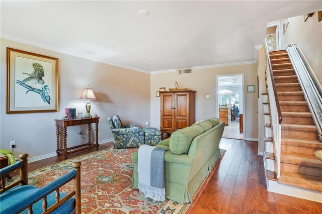 5004-0606 Newlands St, Metairie, LA 70006 - living area with stairway, visible vents, hardwood / wood-style flooring, and ornamental molding