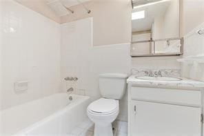 5004-0606 Newlands St, Metairie, LA 70006 - full bathroom featuring toilet, tile patterned floors, vanity, and  shower combination