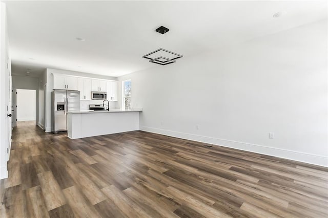 2825-27 Spain St, New Orleans, LA 70122 - interior space with baseboards and dark wood-style floors