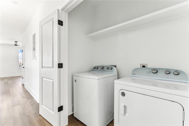 2825-27 Spain St, New Orleans, LA 70122 - laundry room with laundry area, light wood-type flooring, a ceiling fan, washing machine and clothes dryer, and baseboards