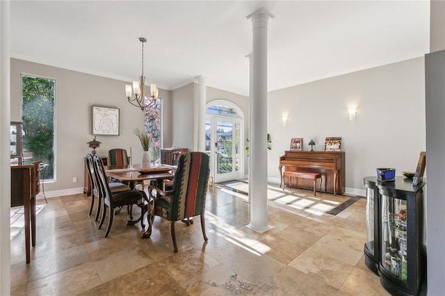 405 14th St, New Orleans, LA 70124 - dining room featuring ornamental molding, baseboards, ornate columns, and a chandelier