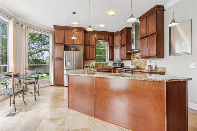 405 14th St, New Orleans, LA 70124 - kitchen featuring wall chimney range hood, range, stainless steel fridge, and a healthy amount of sunlight