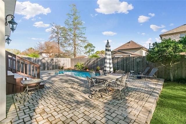 405 14th St, New Orleans, LA 70124 - view of patio / terrace with a fenced in pool, outdoor dining area, and a fenced backyard