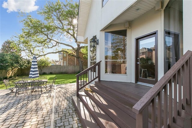 405 14th St, New Orleans, LA 70124 - deck featuring outdoor dining space, a patio area, fence, and a lawn