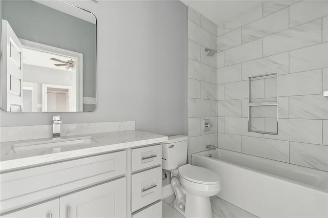 bathroom with vanity, a ceiling fan, toilet, and shower / washtub combination