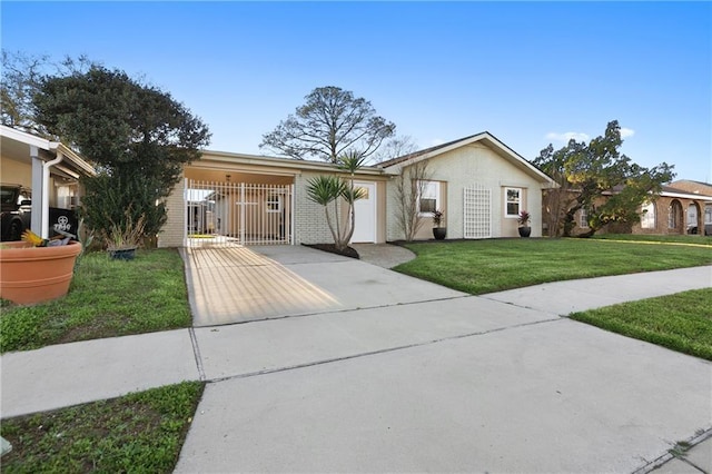 7800 Allison Rd, New Orleans, LA 70126 - ranch-style home featuring concrete driveway, a front yard, brick siding, and a gate