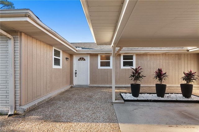 7800 Allison Rd, New Orleans, LA 70126 - property entrance with roof with shingles