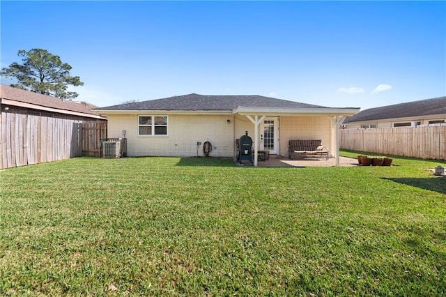 7800 Allison Rd, New Orleans, LA 70126 - back of property with a patio, brick siding, and a fenced backyard