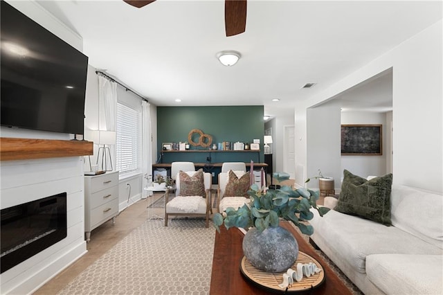 7800 Allison Rd, New Orleans, LA 70126 - living room featuring ceiling fan, a glass covered fireplace, visible vents, and recessed lighting