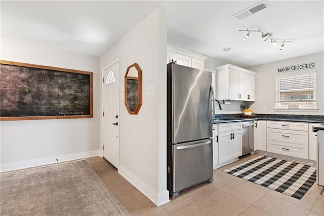 7800 Allison Rd, New Orleans, LA 70126 - kitchen with white cabinets, dark countertops, visible vents, and appliances with stainless steel finishes