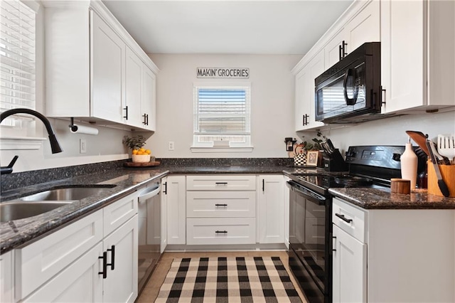 7800 Allison Rd, New Orleans, LA 70126 - kitchen featuring a sink, white cabinets, black appliances, and dark stone counters