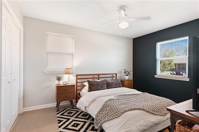 7800 Allison Rd, New Orleans, LA 70126 - bedroom with ceiling fan, a closet, light tile patterned floors, and baseboards