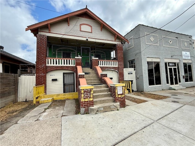 351517 Tulane Ave, New Orleans, LA 70119 - view of front of home featuring stairs, brick siding, and fence