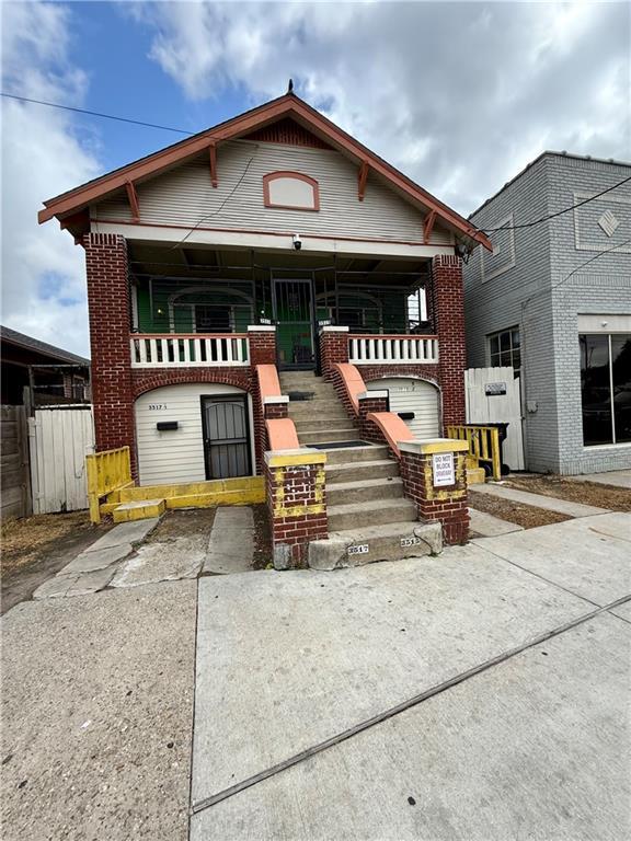 351517 Tulane Ave, New Orleans, LA 70119 - view of front facade featuring brick siding and fence