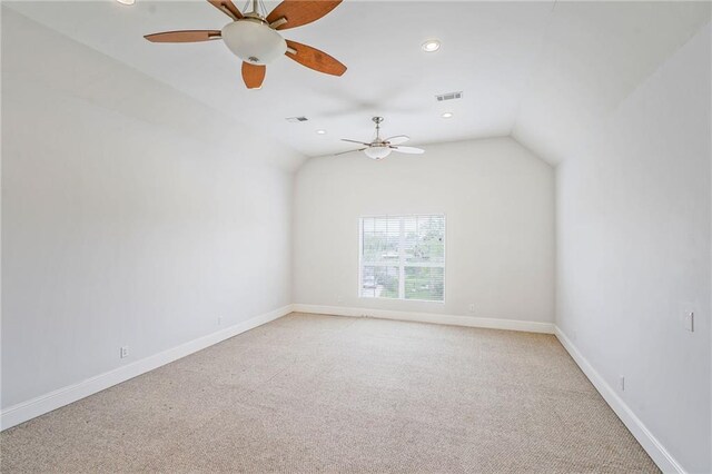 empty room with light carpet, recessed lighting, a ceiling fan, and baseboards
