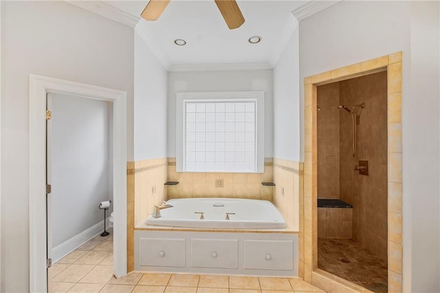 bathroom featuring tile patterned floors, a tile shower, crown molding, a garden tub, and a ceiling fan