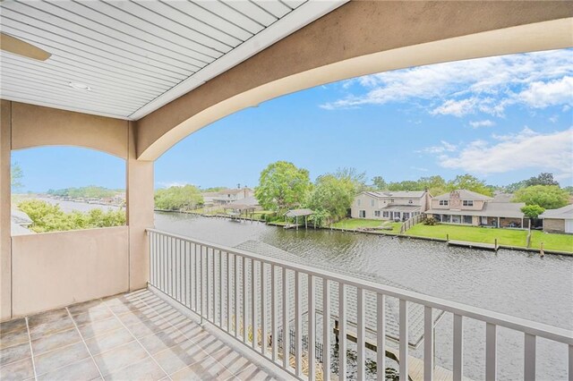 balcony featuring a water view and a residential view
