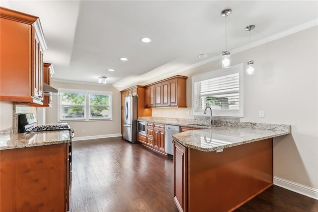 501 Gordon Ave, Harahan, LA 70123 - kitchen featuring stainless steel appliances, a sink, brown cabinets, a peninsula, and baseboards