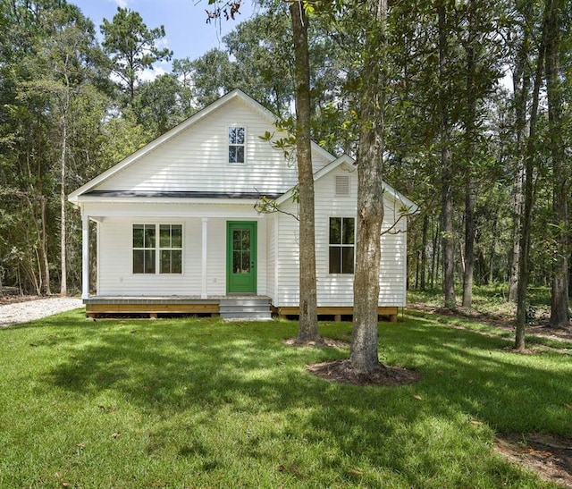 1128 W 19th Ave, Covington, LA 70433 - view of front facade featuring covered porch and a front lawn