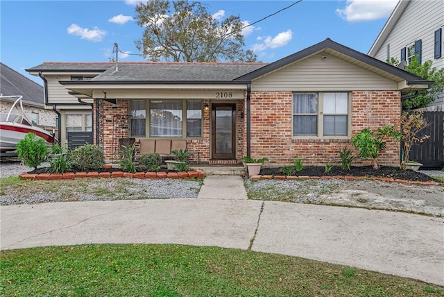 2108 Haring Rd, Metairie, LA 70001 - bungalow-style home featuring brick siding and fence
