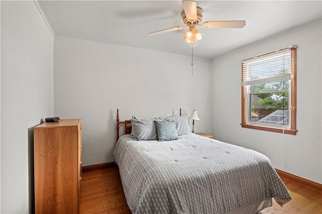800 Marguerite Rd, Metairie, LA 70003 - bedroom with wood finished floors, baseboards, ornamental molding, and a ceiling fan